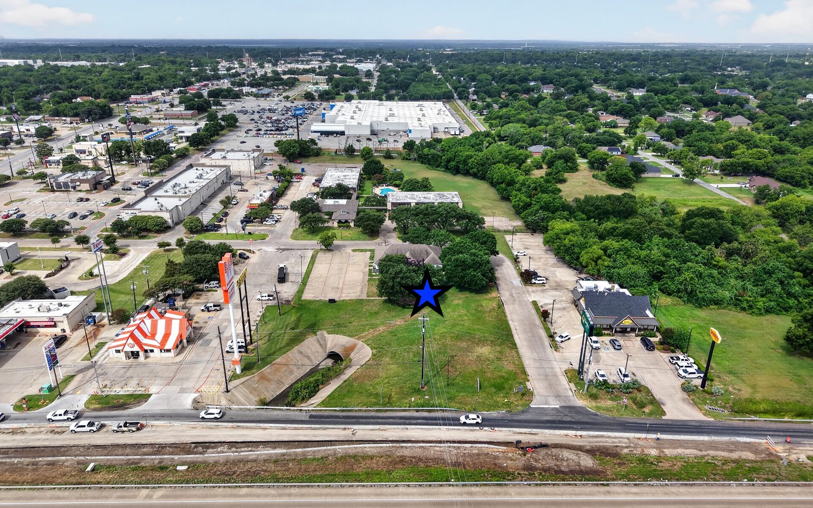 Aerial view showing the building's position on the Interstate 45 corridor